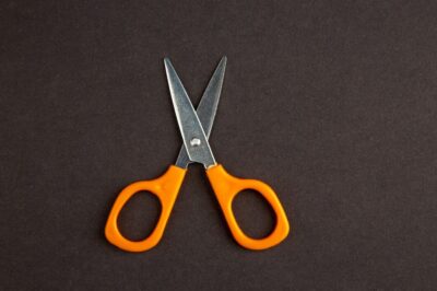 top view orange scissors dark background 179666 22645